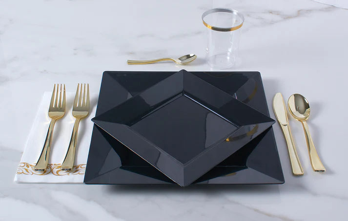 Elegant black and gold dinnerware set for 40 guests, including square plates, utensils, napkins, and cups